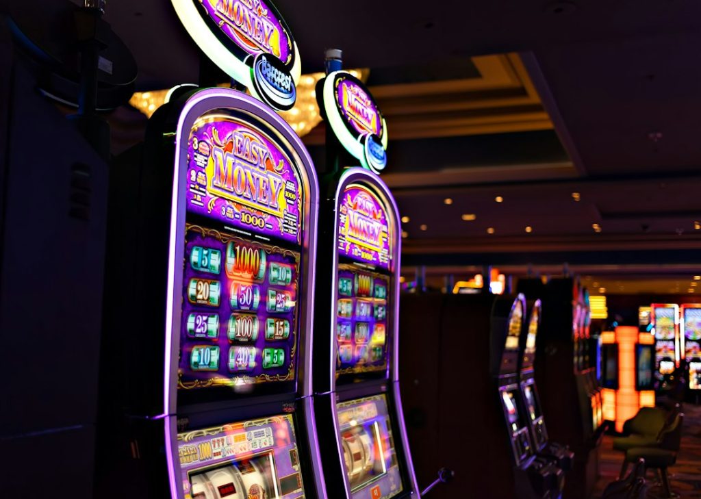 Rows of casino slot machines illustrating how slot game symbols and paytables work