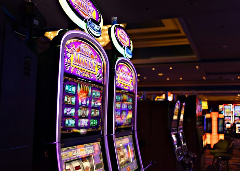 Rows of casino slot machines illustrating how slot game symbols and paytables work